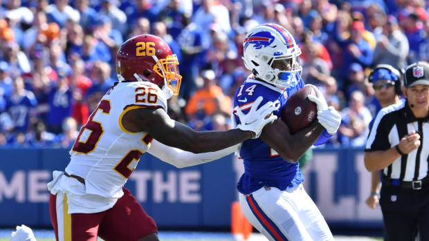 Buffalo Bills WR Stefon Diggs (right) tries to elude Washington's Landon Collins.